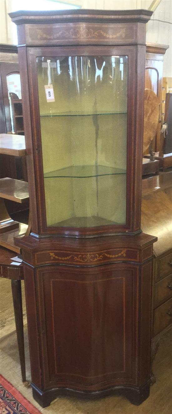 An Edwardian inlaid mahogany serpentine corner cabinet, H.6ft 2in.